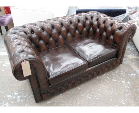 CHESTERFIELD SOFA, two seater, buttoned dark tanned leather, on castors, 161cm L.