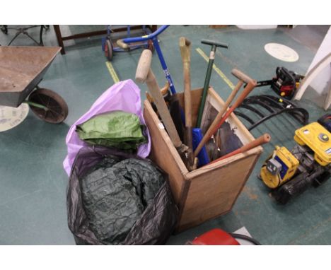 Garden tools, forks, spade, shears, saws and 2 bags of tarpaulin