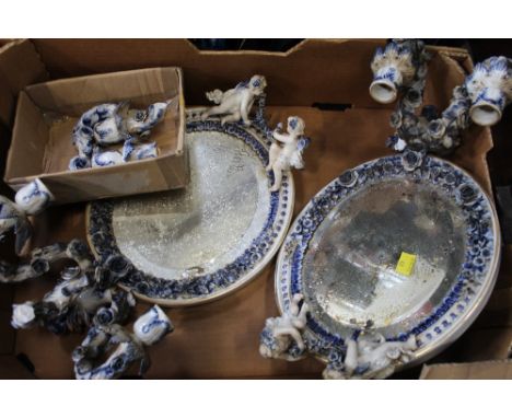 Pair of continental style porcelain wall mounted candlestick holders decorated with cherubs (AF) 