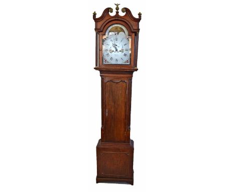 A 19th century oak longcase clock. With double ogival arched pediment, fluted columns and pillasters framing the dial and doo