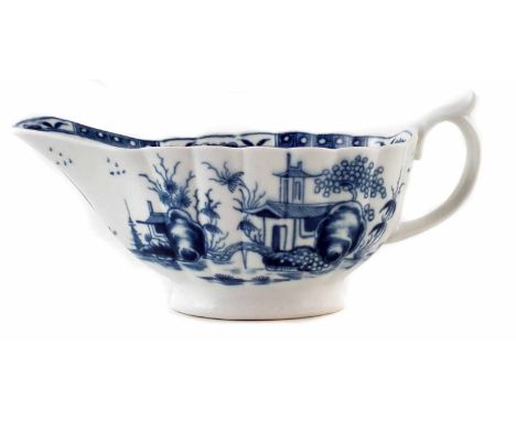 Worcester sauceboat circa 1765, the reeded body painted with the Mission Church pattern in underglaze blue, crescent mark to 