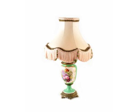 Late 19th century green ground table lamp. Painted with a posy of flowers, with gilded feet. Complete with pale rose and gree