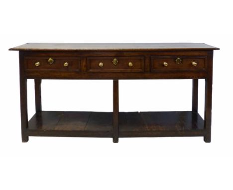 Late 17th century oak dresser base, two plank top with moulded edge above three frieze drawers, six square section legs unite