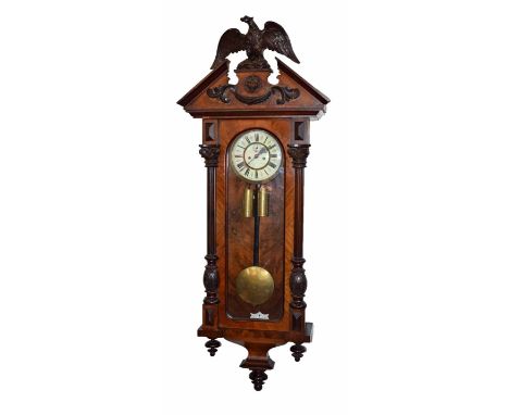 Vienna regulator with walnut and beech case. With carved phoenix and lion's head embellishment and Corinthian pillars framing