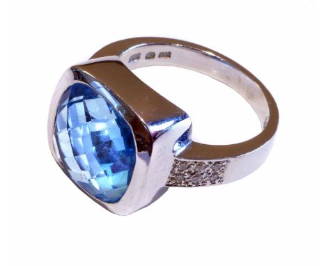 14ct white gold topaz and and diamond ring, cushion cut blue topaz in square bezel setting, diamond set shoulders, gross weig