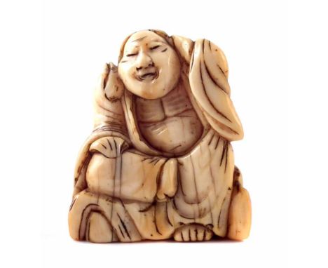 18th century Japanese ivory Netsuke of a sitting saintly figure, possibly a Rakan, height 3.6cm.