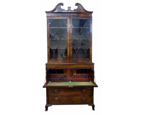 George III mahogany bookcase on secretaire, top section with swan neck pediment above two astragal glazed doors covering thre