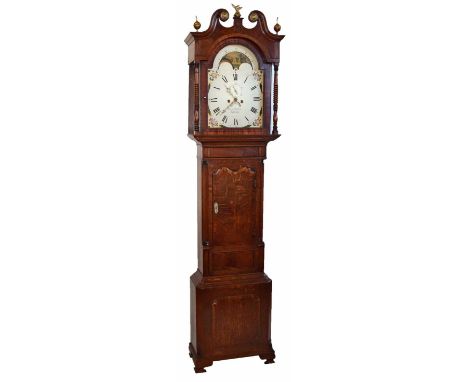 A 19th century mahogany longcase clock. With double ogee arched pediment, rope twist columns and fluted pillasters framing th