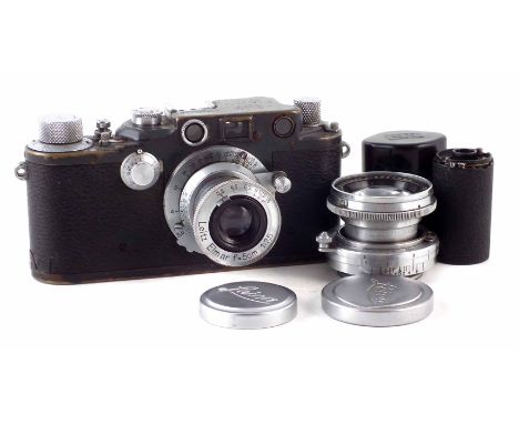 Leica IIIC camera circa 1943 serial number 390117, with black enamel finish, fitted with Leitz Elmar f=5cm 1:35 lens with cap