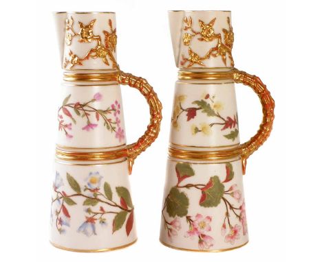 Pair of Royal Worcester ewers, with moulded blossom details, decorated with flora on an ivory ground, puce printed marks, sha