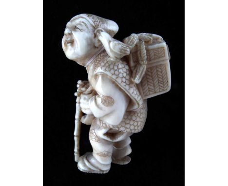 Late 19th century Japanese ivory Netsuke, boy with basket and staff, signed Masayuki, height 4.3cm.