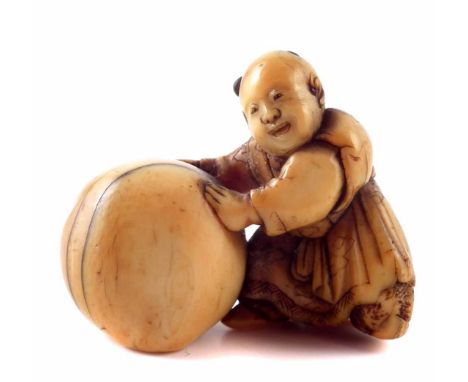 19th century Japanese ivory Netsuke boy with ball signed Minkoku, height 3.4cm.