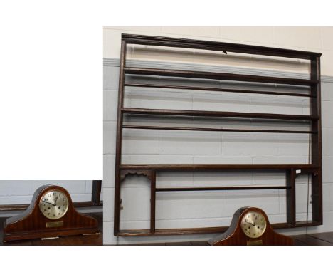 A stained pine Delft rack, 135cm high; and a mahogany presentation mantel clock, dated April 21st 1925 (2)