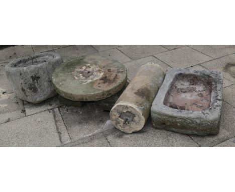 A group of weathered garden stone comprising a rectangular trough; a circular trough; and a column with a circular top and tw