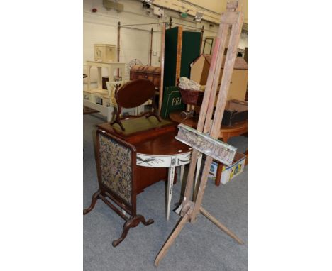 A mahogany and cream painted demi-lune side table, a carved firescreen and a folding easel (3)