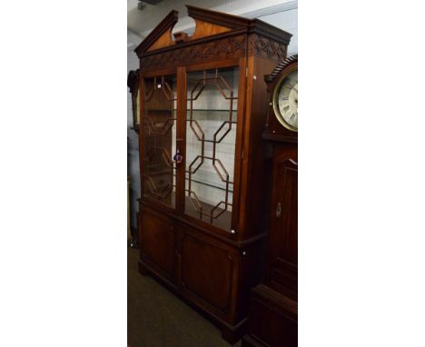 A Chippendale style mahogany bookcase, 240cm by 135cm by 43cm