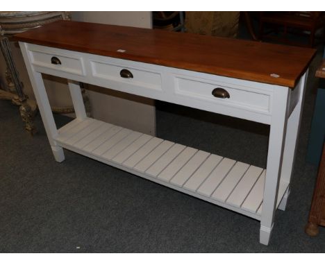 A modern white painted oak topped narrow hall table, fitted with three frieze drawers and the legs joined by a shelf stretche