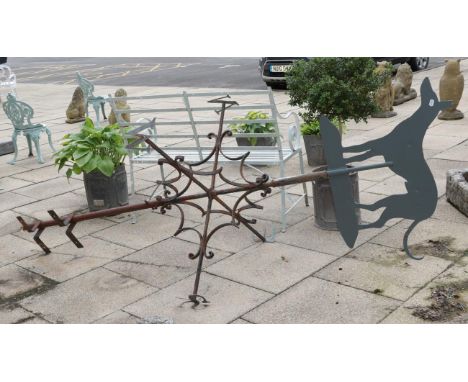 A wrought iron weather vane 