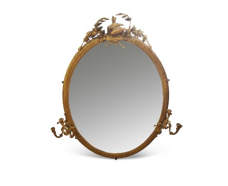 An extremely large 19th Century oval girandole wall mirror of oval form, the top with a bird and foliate mount, the oval gilt