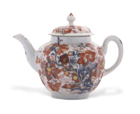 An 18th Century Worcester porcelain teapot and cover of fluted design, blue and white with clobbered over glaze red decoratio
