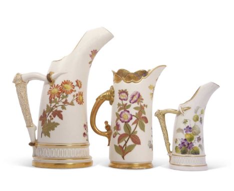 A group of three Royal Worcester jugs, one of tusk form, two others with antler handles, all three painted with flowers, larg