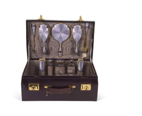 An early 20th Century Walker &amp; Hall cased silver and enamel travelling vanity case, the purple leather coloured case with