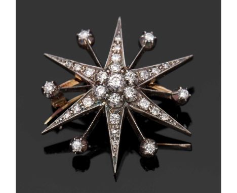 A diamond star brooch, the diamond set six pointed star, with a blade between each point set with a single diamond, total wei
