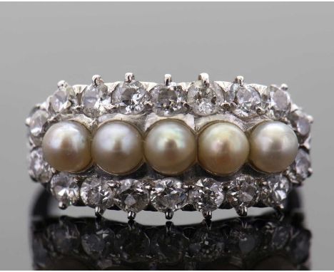 A cultured pearl and diamond ring, the five slightly graduated round cultured pearls, seta bove and below with round brillian