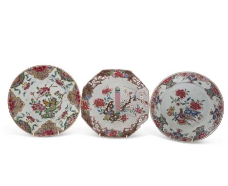 A group of three 18th Century Chinese plates, one of octagonal form with a scroll and birds in branches in famille rose palle