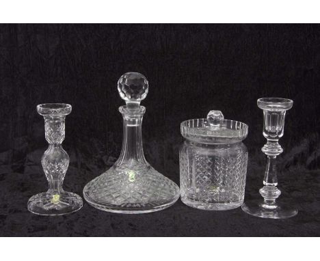 A group of Waterford Crystal glass wares including a ships decanter, biscuit barrel and cover and two candlesticks