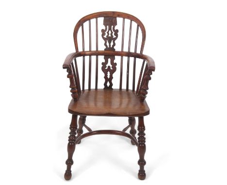 An early 19th Century yew and elm Windsor chair with stick and splat back, turned legs and a crinoline stretcher, 93cm high, 