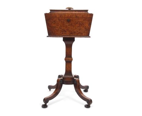 An early Victorian walnut veneered pedestal teapoy the rectangular top section with hinged lid opening to a fitted interior w