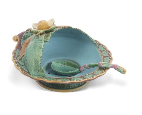 A 19th Century Minton Majolica soup tureen and ladle in typical Majolica glazes with moulded leaf design and nut knop