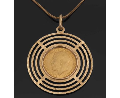 A 1918 sovereign pendant necklace, the sovereign mounted in a three ring circular frame stamped 750, 15.3g, on foxtail chain 