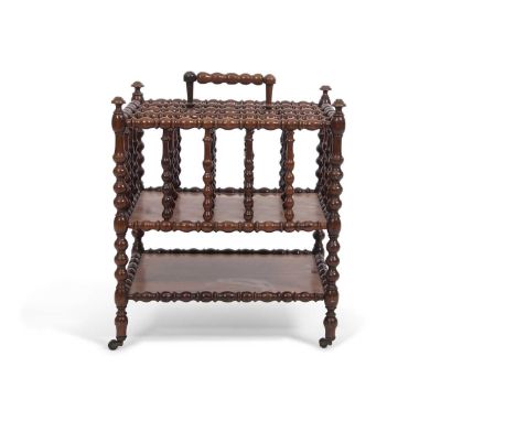 An unusual Victorian rosewood Canterbury magazine rack with elaborate bobbin turned frame and four sub-divisions to the top o