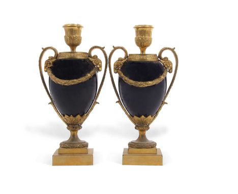 A pair of 19th Century French Empire style blue ceramic and gilt metal mounted covered combination jars and candlesticks with