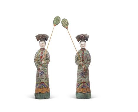 Pair of Chinese Nodding Figures Qing Dynasty 19th century modelled as attendants in a famille vert palette with floral sprays