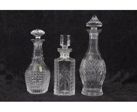 A group of three Waterford Crystal glass decanters of square and oval shapes