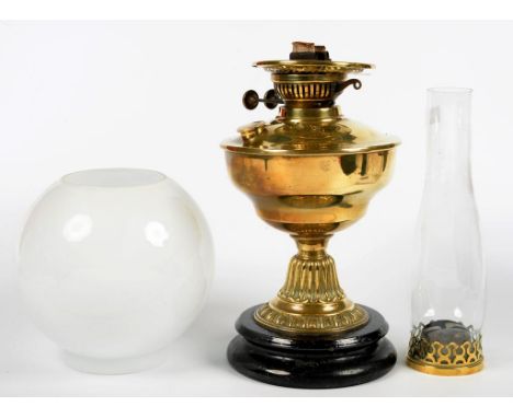 A  BRASS OIL LAMP ON BLACK GLAZED FOOT, 27CM H,  C1900 