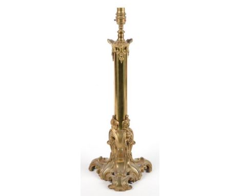 A VICTORIAN BRASS LAMP ON LEAFY OPENWORK TRIFORM FOOT, 45CM H, EXCLUDING LATER FITMENT 