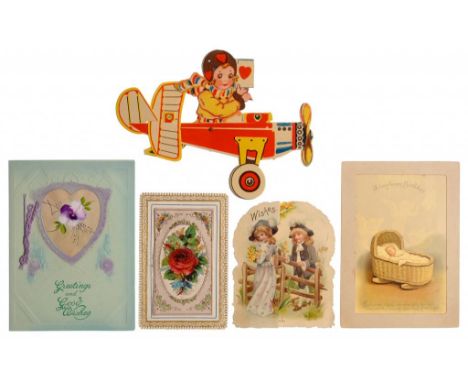 A LATE VICTORIAN OR EDWARDIAN HOLD-TO-LIGHT BIRTHDAY CARD  with three cherubs around a cradle, 14cm h, a Victorian mechanical