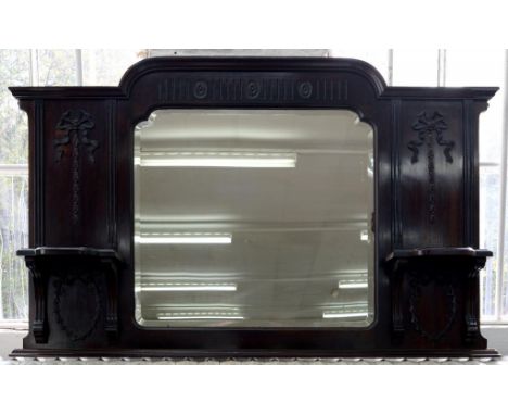 AN EDWARDIAN MAHOGANY OVERMANTEL MIRROR OF BREAK ARCHED FORM, THE BEVELLED PLATE FLANKED BY BRACKET SHELVES, 82CM H, 127CM L,