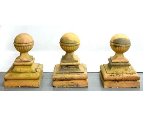 A SET OF THREE LATE VICTORIAN OR EDWARDIAN TERRACOTTA GATE OR SIMILAR PIER FINIALS ON SQUARE BASE, 66CM H 