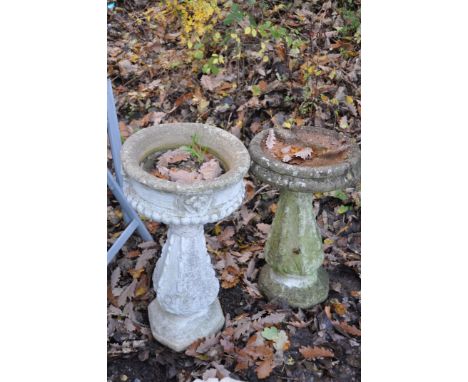 A WEATHERED COMPOSITE PLANTER, on a tall column, diameter 39cm x height 72cm, and a composite bird bath on a similar stand (c