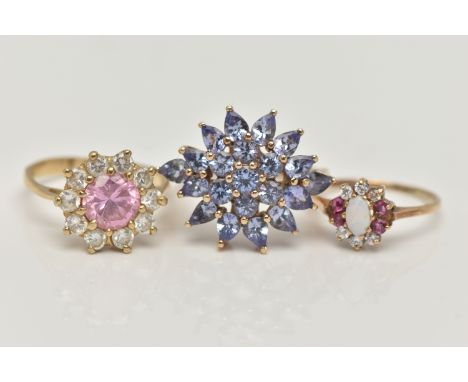 THREE GEM SET RINGS, to include a tanzanite cluster ring, prong set in yellow gold, hallmarked 9ct Birmingham, ring size N, a