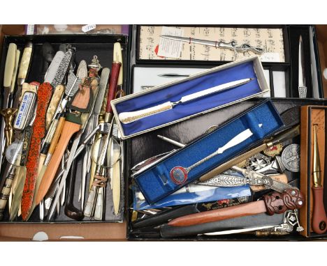 A BOX OF NOVELTY, COMMEMORATIVE AND SOUVENIR LETTER OPENERS IN TREEN, CERAMIC, ASSORTED METALS, some boxed sets, two of golf 