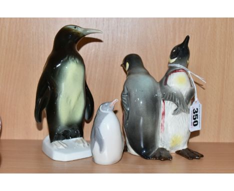 THREE CERAMIC PENGUIN FIGURES, comprising a Beswick Courting Penguins figure group, model no 1015, a Royal Copenhagen penguin