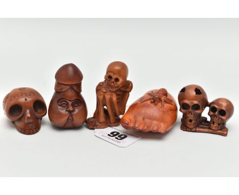 FOUR 20TH CENTURY CARVED TREEN NETSUKE AND AN OKIMONO, carved as a human skeleton, human skulls and other body parts, spider 