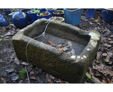 A RECTANGULAR SANDSTONE TROUGH, length 69cn x 46cm x height 30cm (condition report: one corner with a historical chip)
