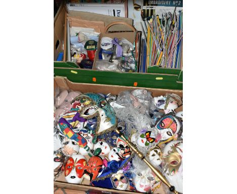 TWO BOXES OF DECORATIVE MASKS AND NEEDLEWORK ITEMS, to include a collection of more than twenty small mainly ceramic masks, t